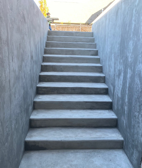 A set of finished concrete gray stairs